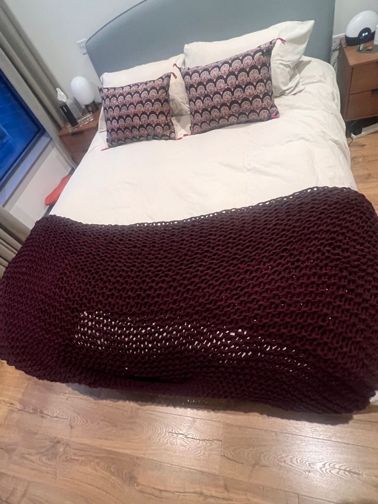 Purple knitted throw blanket