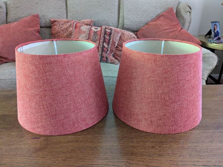 Pair of lampshades in a burnt orange hessian effect