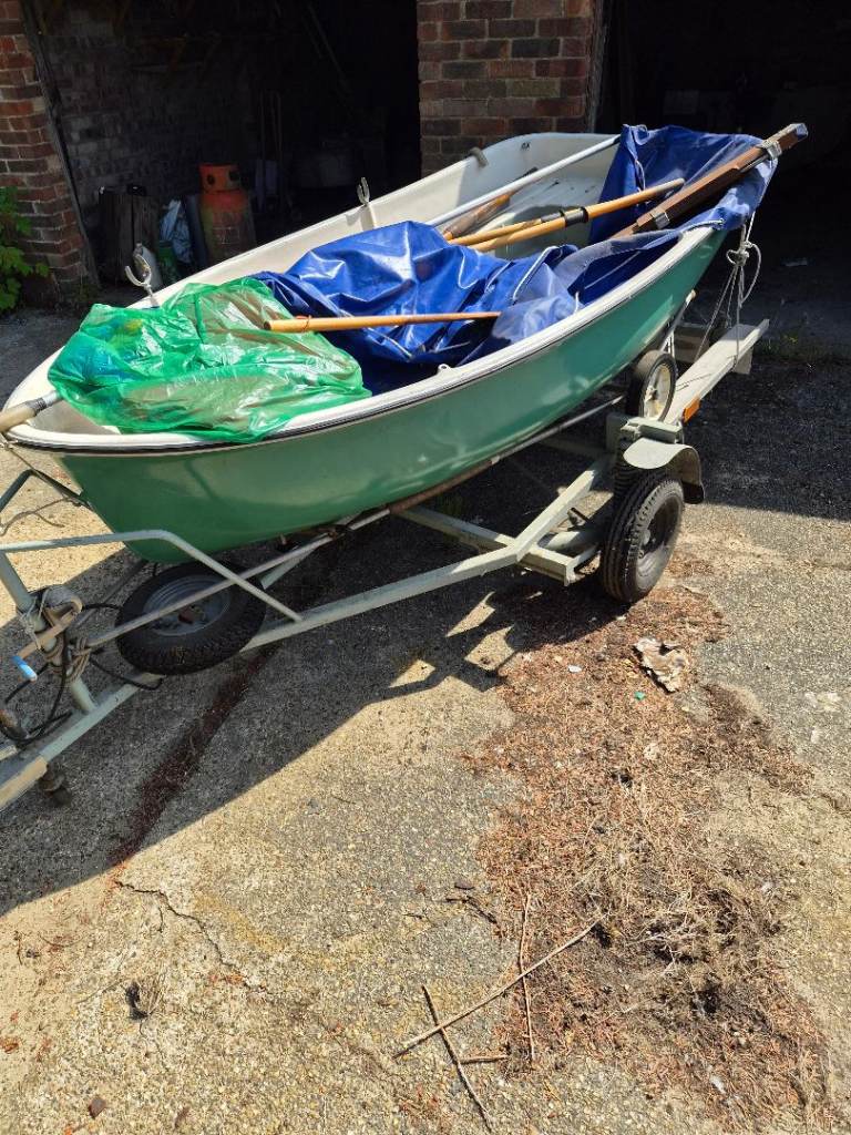 Small Green Boat with Trailer and Oars – Fair Condition
