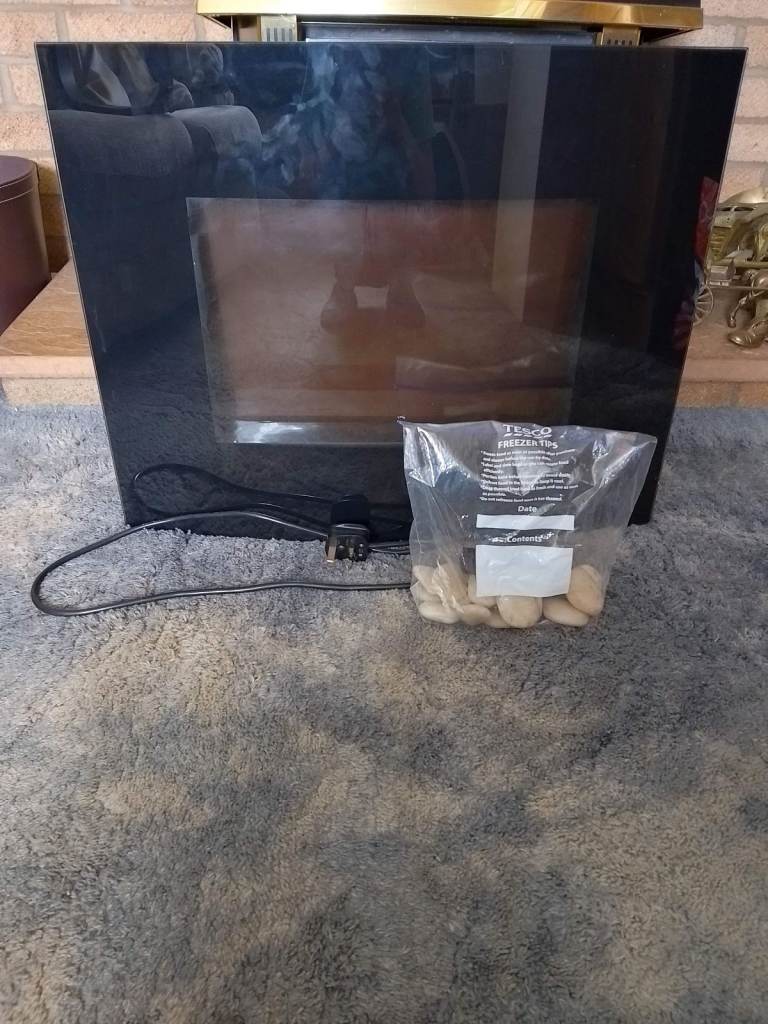 Black Glass Fronted Fire Heater - with Decoritive stones + A Remote Control for Operating the Heater