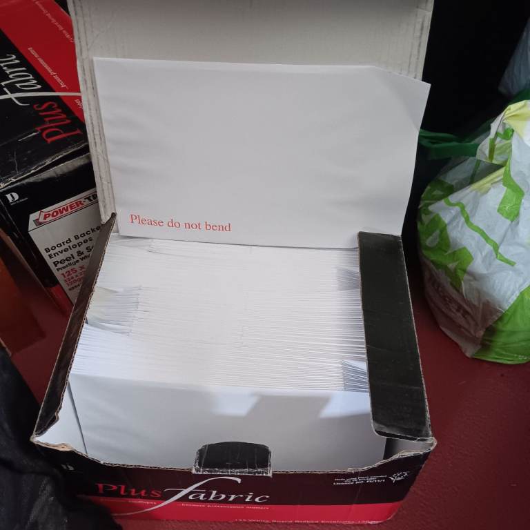 2 boxes of white hardback envelopes 