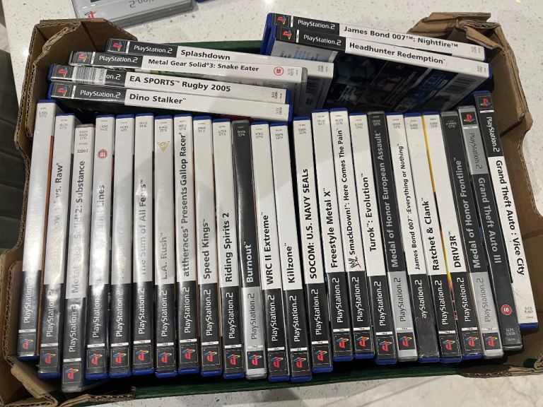PlayStation 2 with games and microphones 