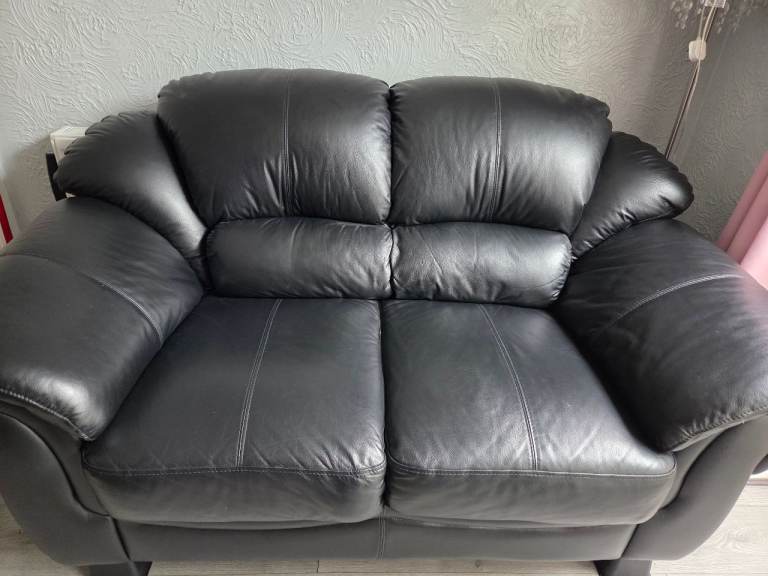 2 black 2 seater leather sofas