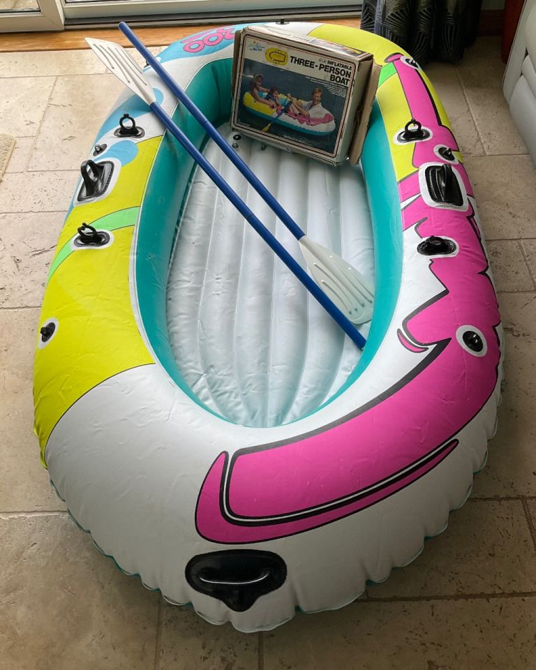 THREE-PERSON INFLATABLE BOAT and TWO OARS