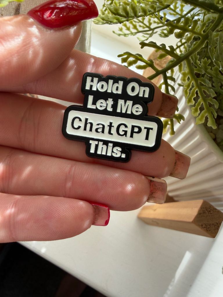Hold on let my ask chatHPT this enamel pin badge 