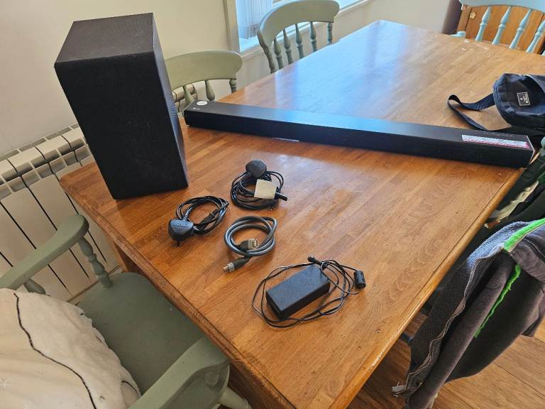 Black Soundbar and Subwoofer with Cables