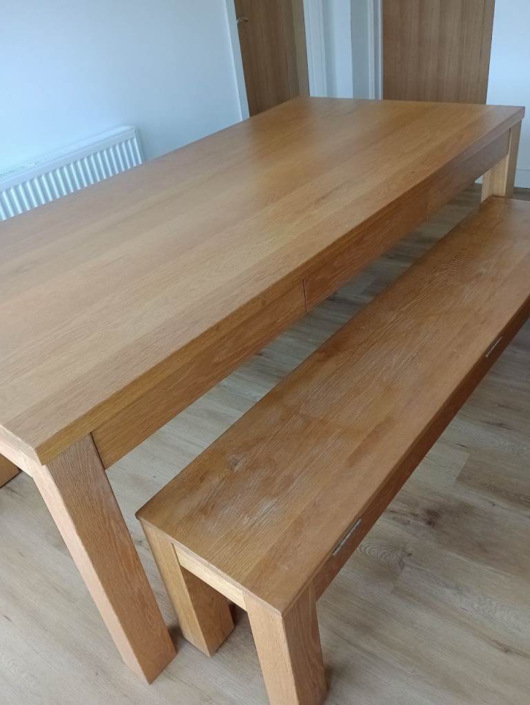 Solid wood iroko dining table with 2 bench seats with drawers and storage