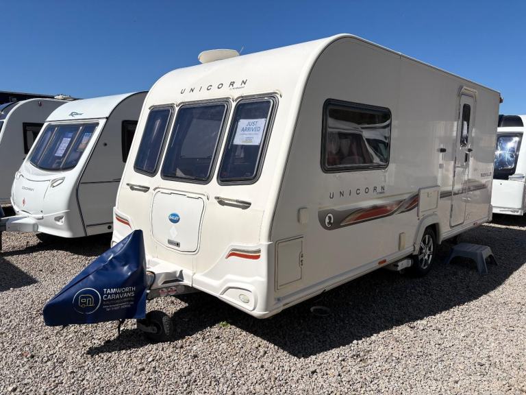 BAILEY UNICORN SEVILLE - 2 BERTH CARAVAN WITH END WASHROOM + MOTORMOVER