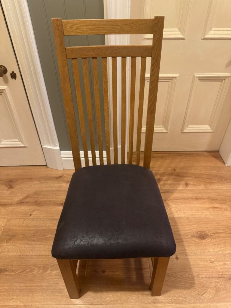 Beautiful solid wood dining chairs with leather seat cushions