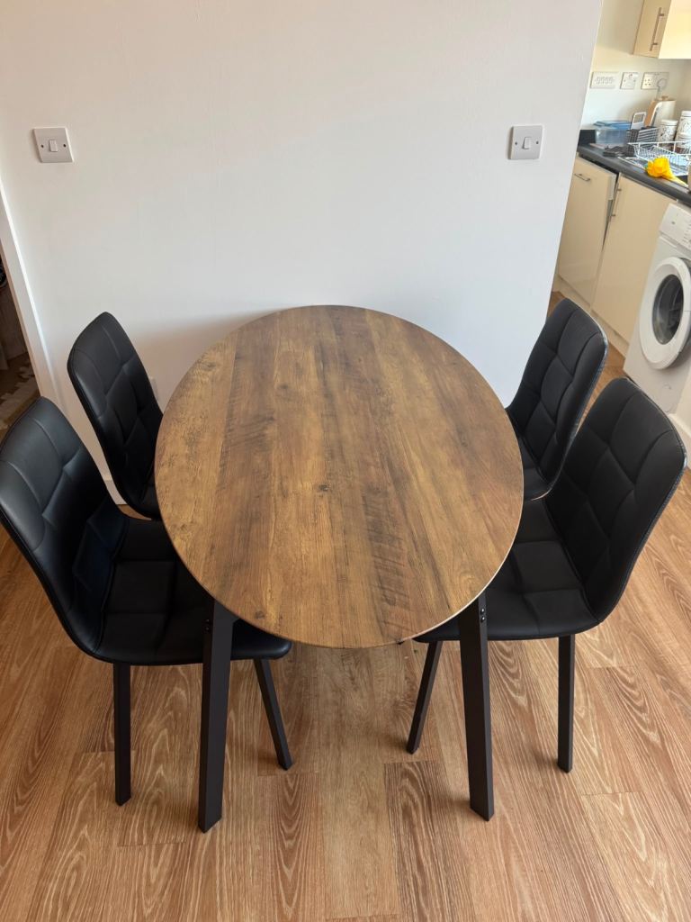 Modern Oval Dining Table and 4 Black Chairs