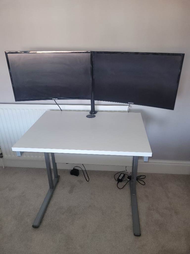 Two 24 inch Samsung curved screen monitors with desk