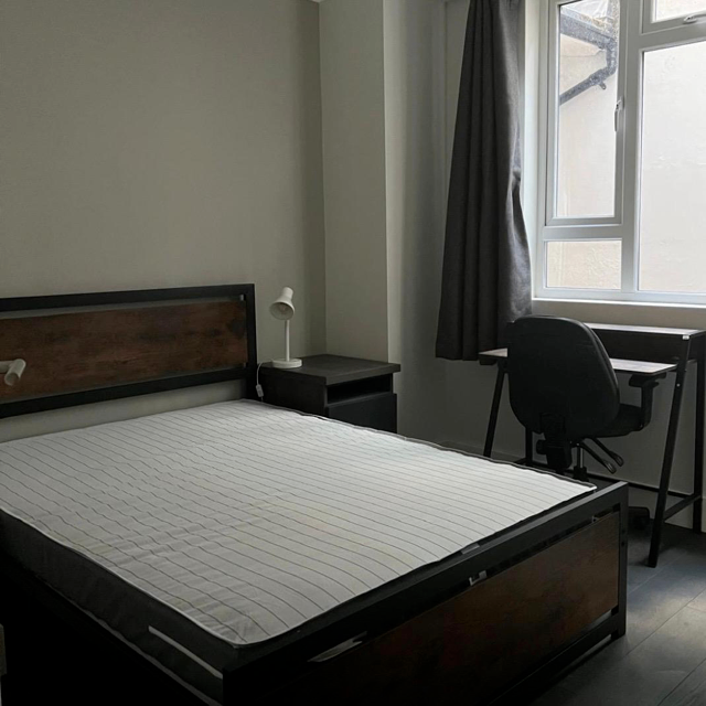 Bed with mattress and desk