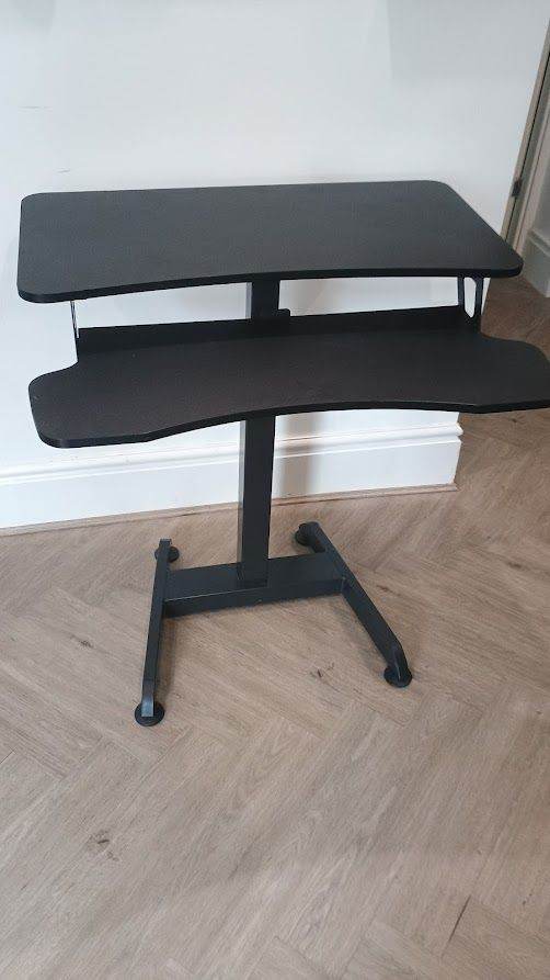 Black adjustable-height standing desk 