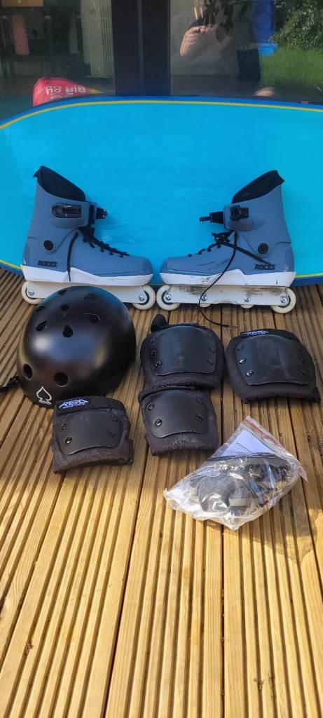 Rollerblades, pads and helmet