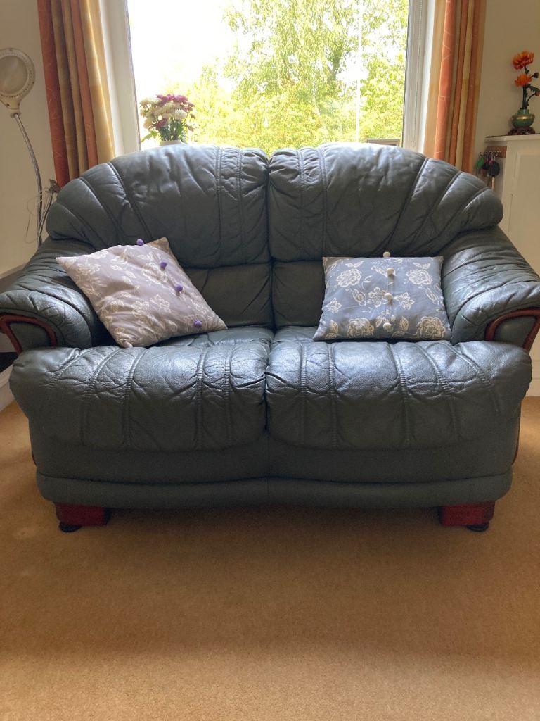 Slate grey/blue Italian leather sofas and footstool 