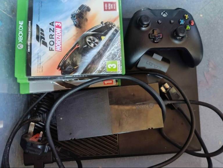 Xbox one with games and battery packs for controller