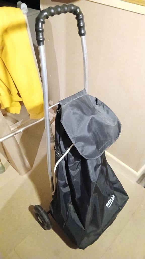 Rolla branded black shopping trolley with two wheels