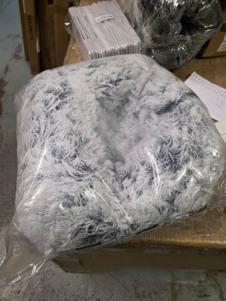 A new still packed fluffy pet bed .