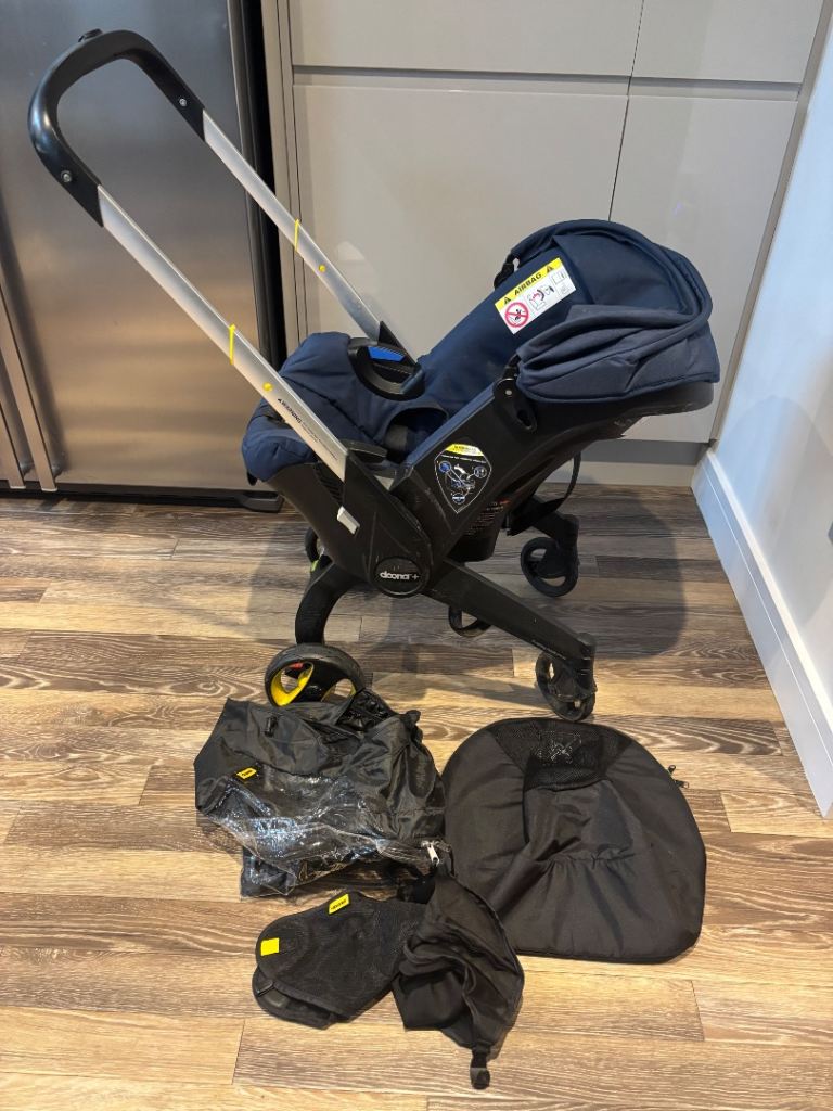 Doona+ 2 in 1 Stroller/Car Seat, includes rain cover, sun shade/protector & travel bag
