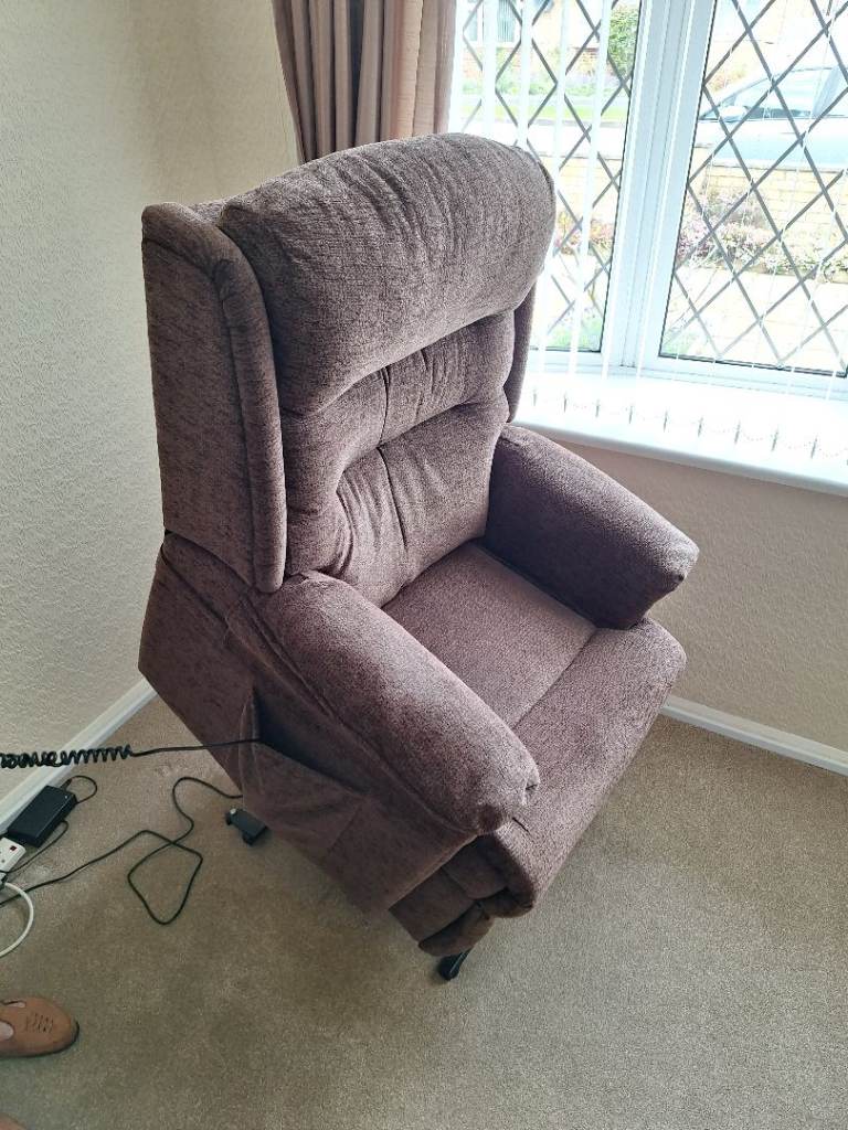 Two HSL riser recliner chairs and a matching two seater sofa in chocolate brown colour