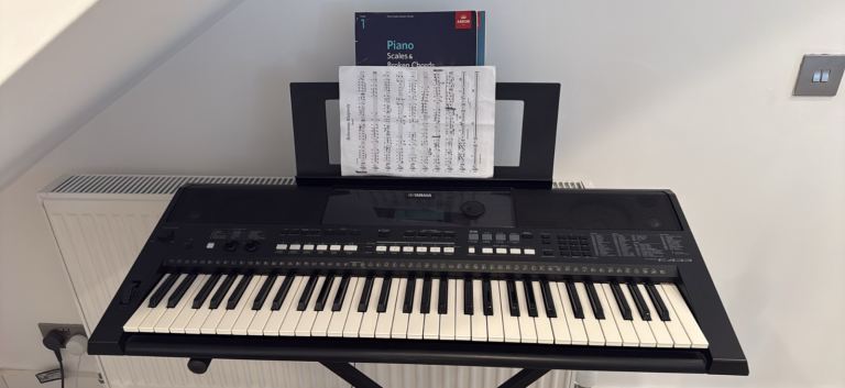 Yamaha Electronic Keyboard with Stand – Good Condition