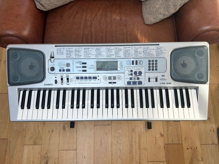 Casio CTK-591 61-key Digital Electronic Keyboard (includes stand and power supply) 
