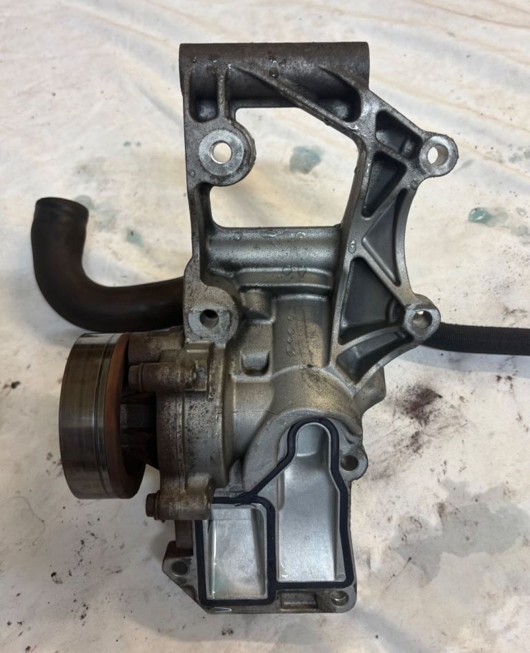 genuine BMW Mini f56 WP support bracket and thermostat housing