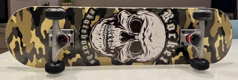 Rocket Skateboard with Pads – Good Condition