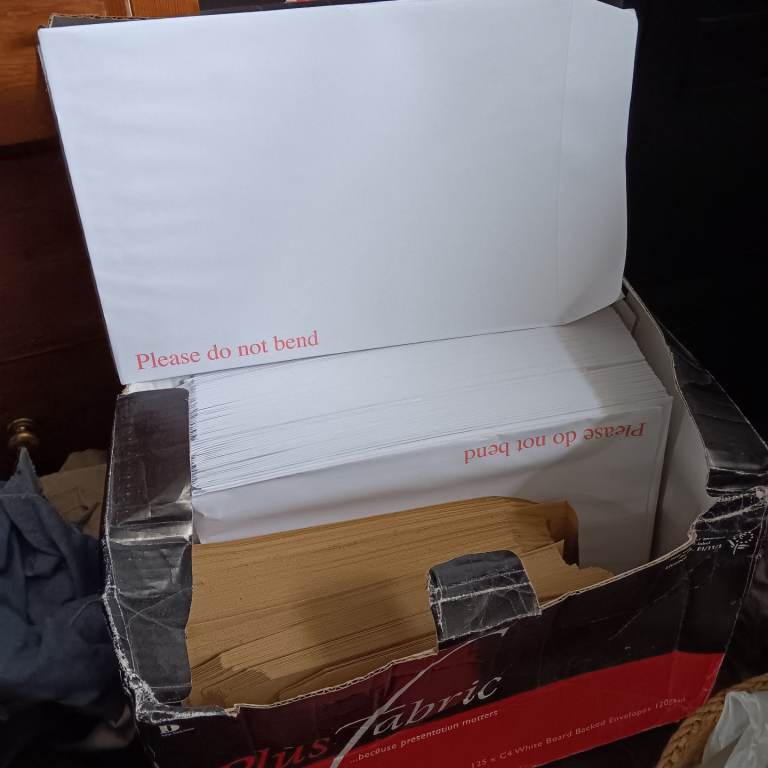 2 boxes of white hardback envelopes 