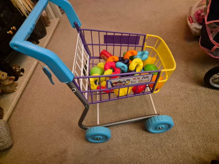 Kids shopping trolley and sit and ride