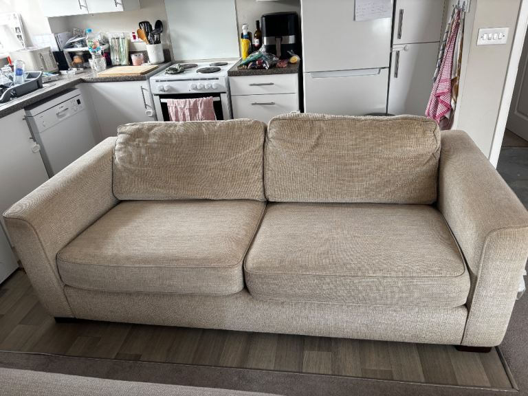 Comfortable Beige Two-Seater Sofa – Good Condition