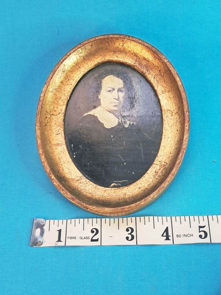 Antique portrait appears to be a 19th-century oil painting on board.