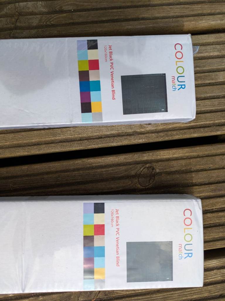 Two black venetian blinds