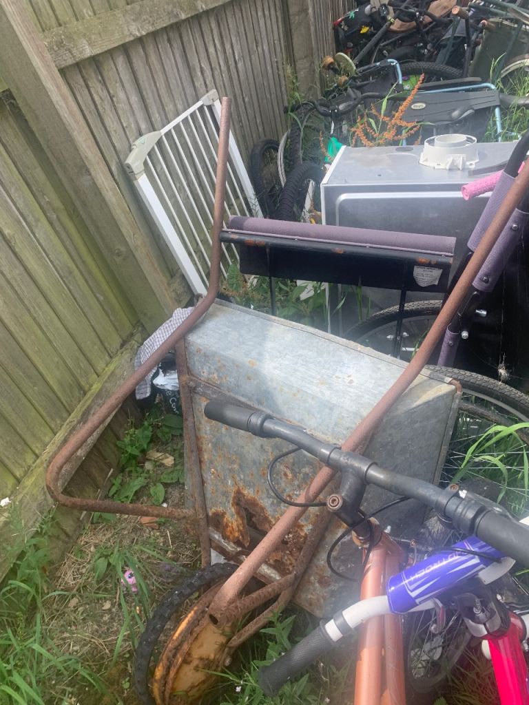 Rusty Old Wheelbarrow for Garden Clearout