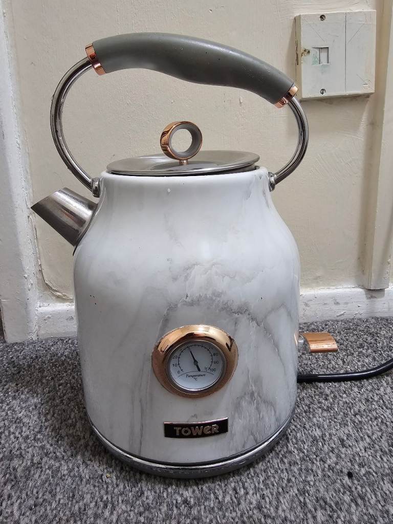 Vintage marble style kettle and black toaster 