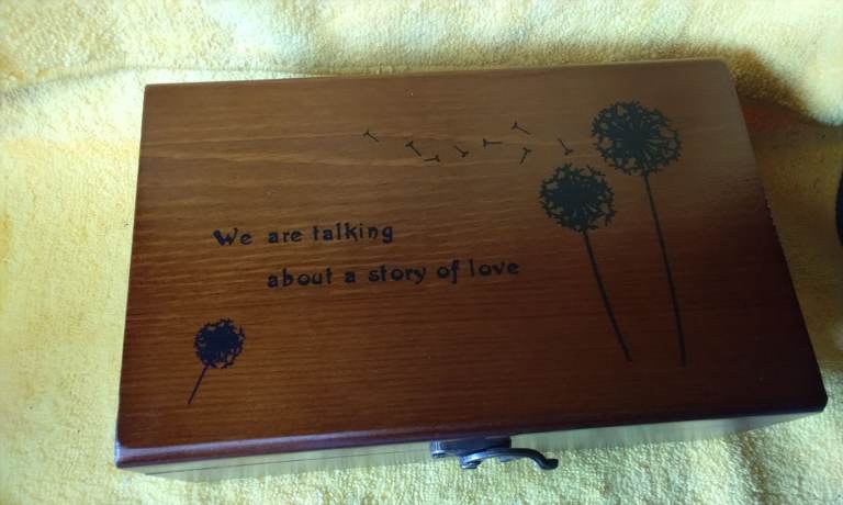 Wooden sewing box with sewing kit.