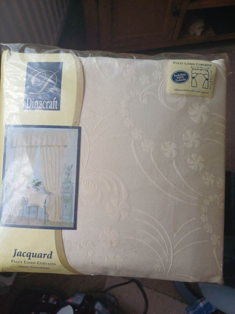 Cream fully lined Jacquard curtains