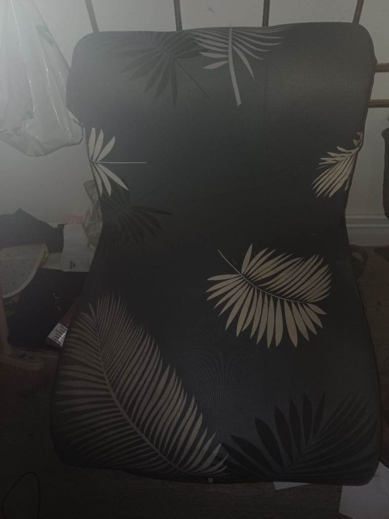 Stylish Black Chair with Leaf Pattern – Good Condition
