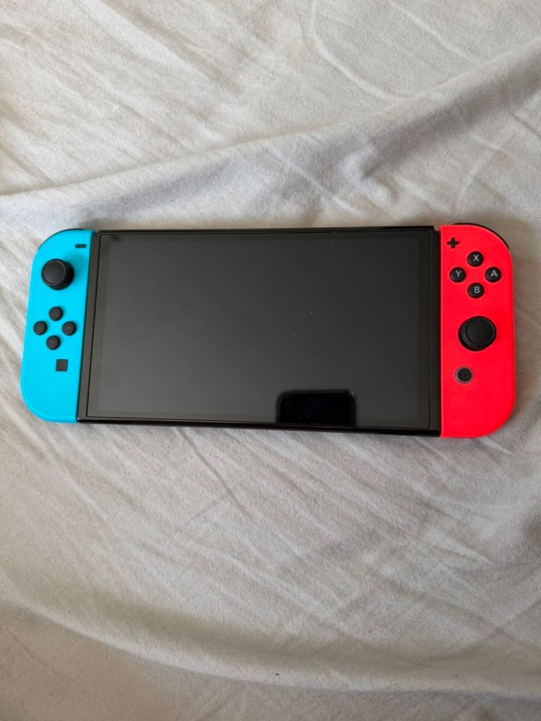 Nintendo Switch OLED with Dock, Case, and Games – Excellent Condition