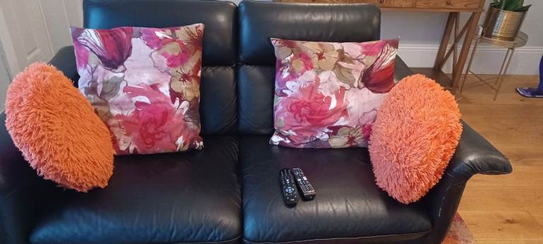 Two seater Italsofa black leather sofa with adjustable headrests