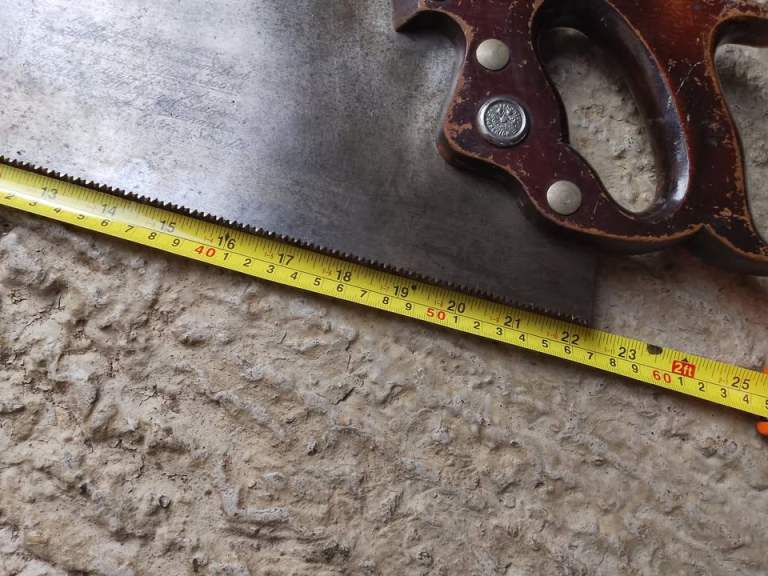 Vintage Warranted Superior Carpenters Saw is a 22-inch hand saw with a 9tpi blade, 