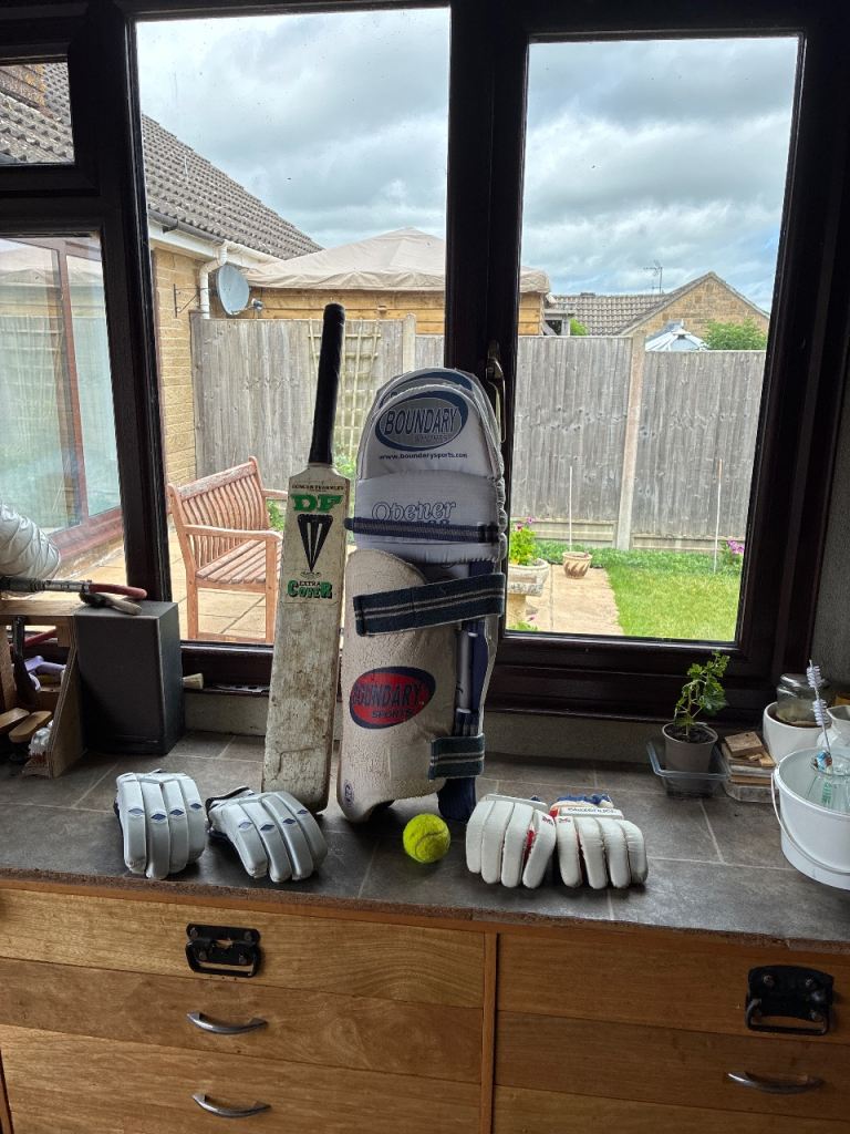 Cricket pads gloves bat ball 