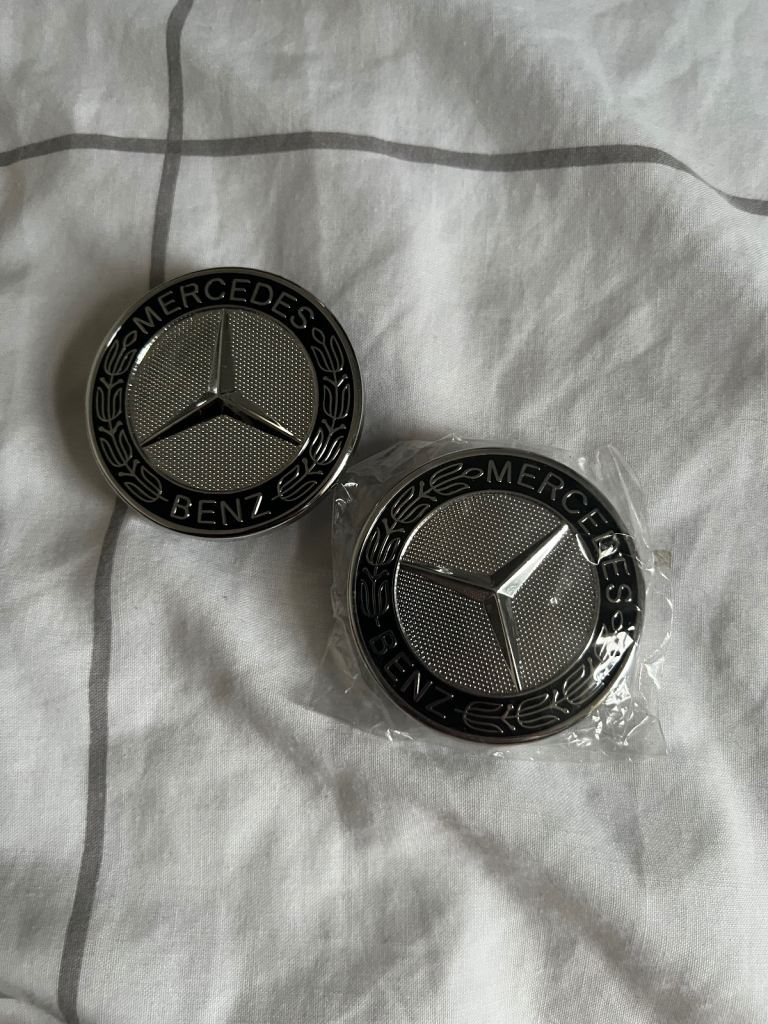 Two Mercedes Benz emblems 