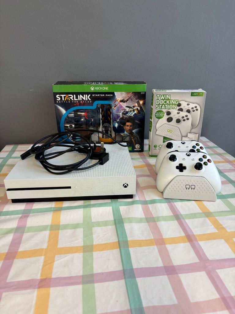 X Box one, with twin docking station, two controllers And 22 games