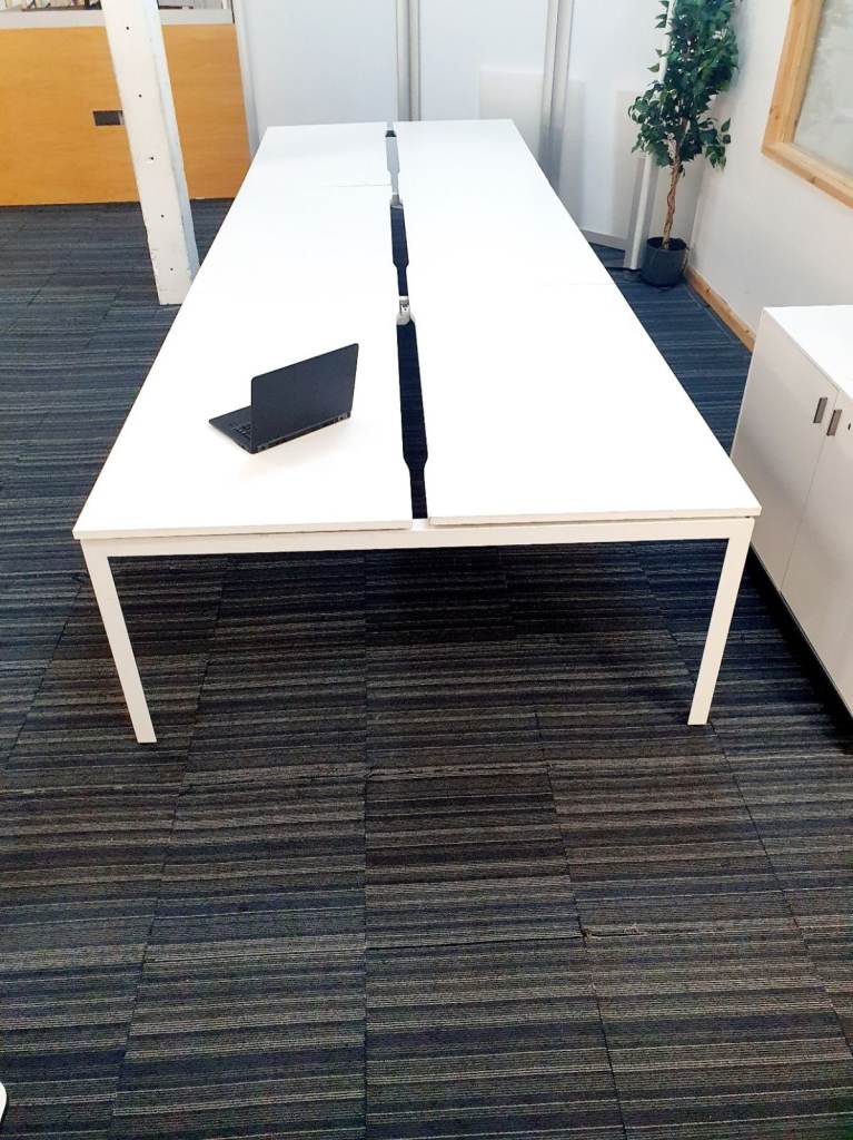 Second hand Herman Miller 8 seater office bench in white 160cm x 640cm each desk