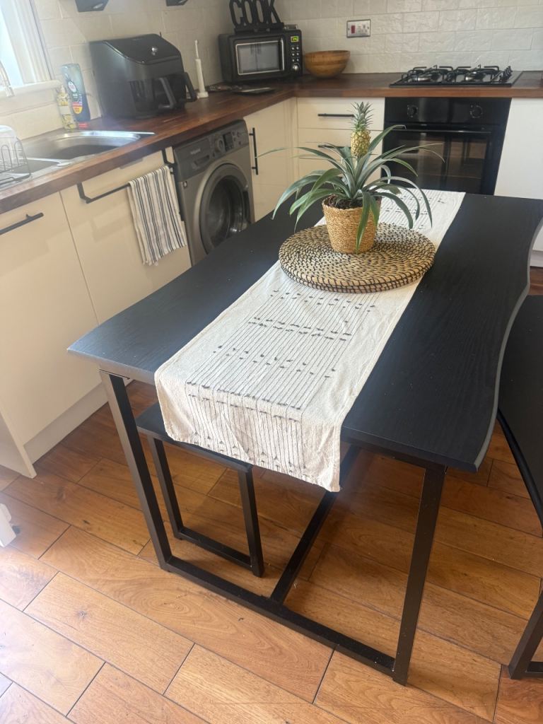 Black wave effect dining table and benches