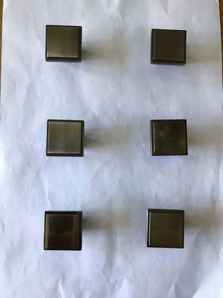 Door handles for wardrobes or a chest of drawers