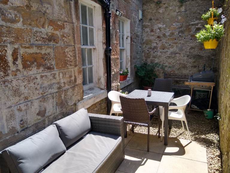 Large main door Georgian flat with private suntrap terrace in Trinity
