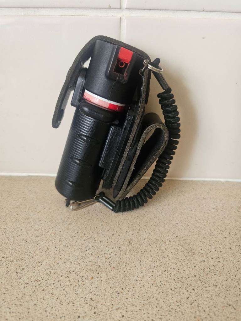 Peter jones pepper spray holder with half tin of red spray 
