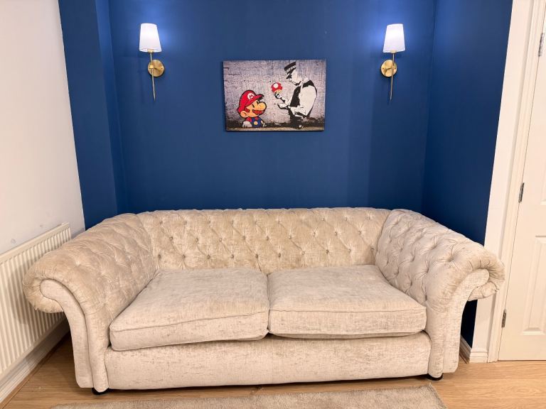 LANGHAM BONGO CHESTERFIELD STYLE SOFA, UPHOLSTERED IN VELVET CREAM